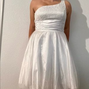 White one shoulder sparkly dress.